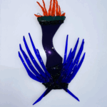 Lasiteos jossa on liekkejä.